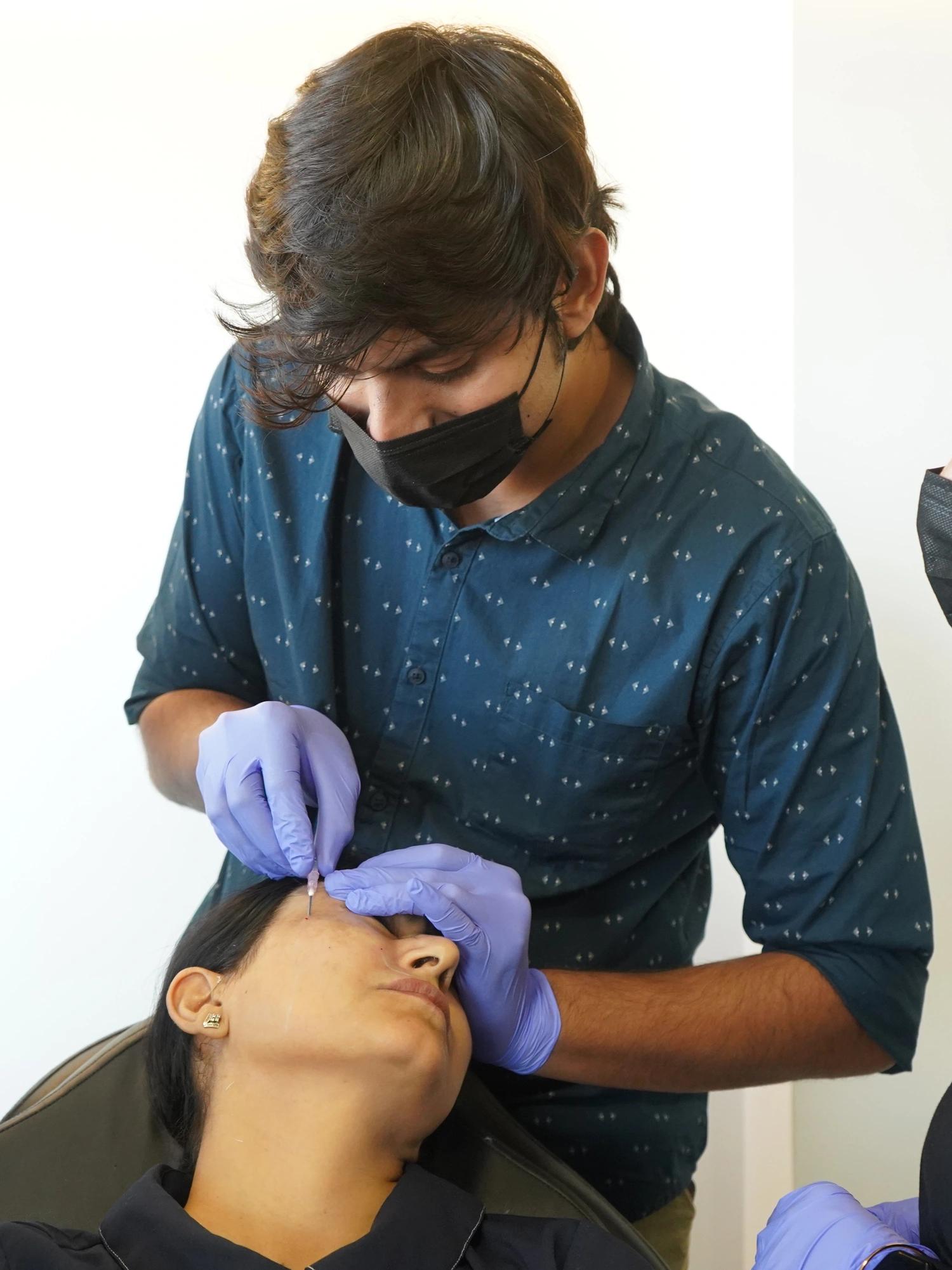 Participant performing Carbon Peel Laser